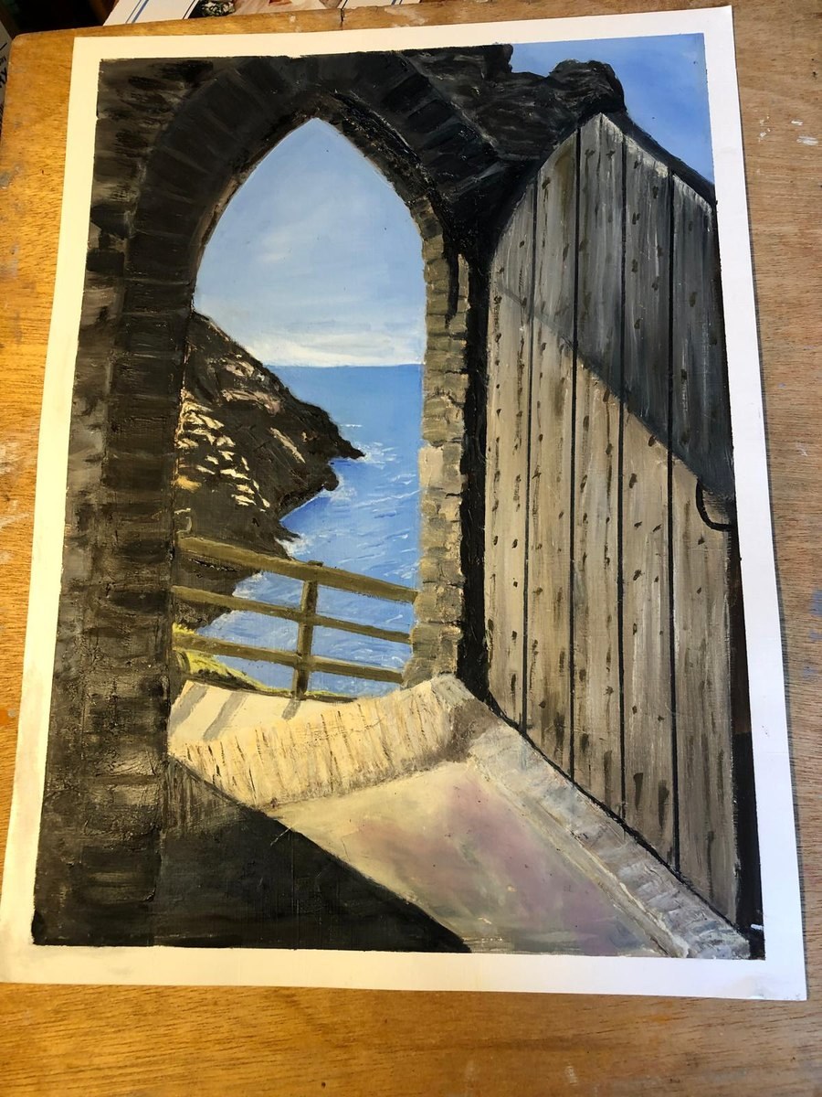 Cindy’s oil: the studded oak door at Tintagel standing open in a stone arch, framing the cliff and sea beyond