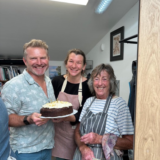 Wendy, right, with her carrot cake at Art Club
