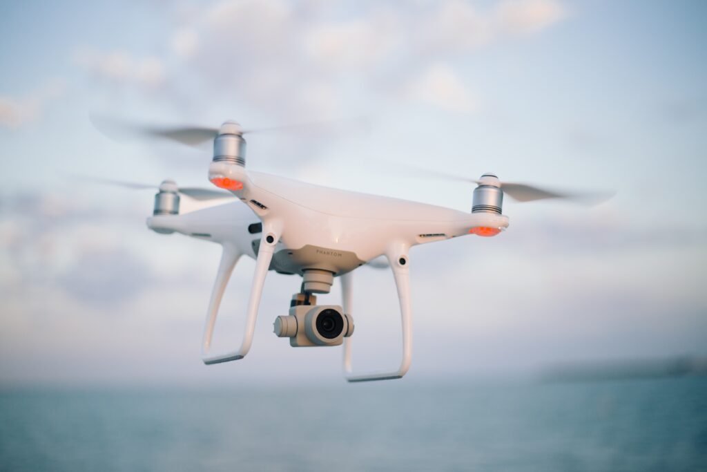 A camera drone flying over the sea
